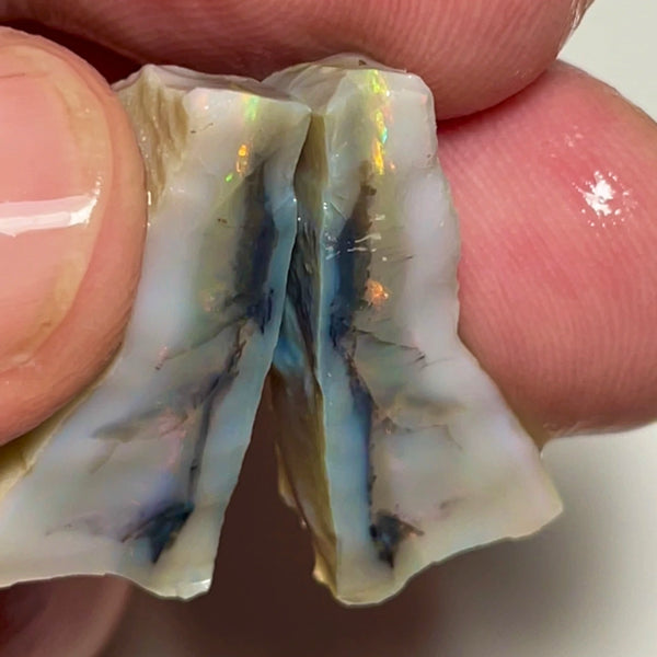 Gorgeous Dark Base Seam rough split pair 31.00cts Yellow dominant Multifires bits of reds showing lots of potential 26x8x8 & 26x7x6mm NSW121