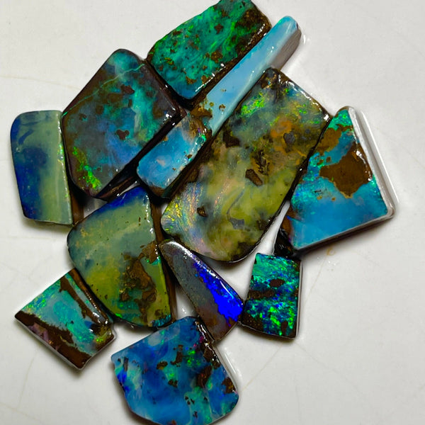 Winton Boulder opal Rubs/rough/preforms parcel 76.50cts Nice faces mostly greens/blues/Yellows 23x10x3 to 9x5x2mm NEW939