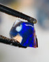 Mulga® Bright Royal Blue dominant fires on Black/DarkOpal Rough Rub Miners Bench® 0.50cts Gorgeous face 6x6x3mm NS210