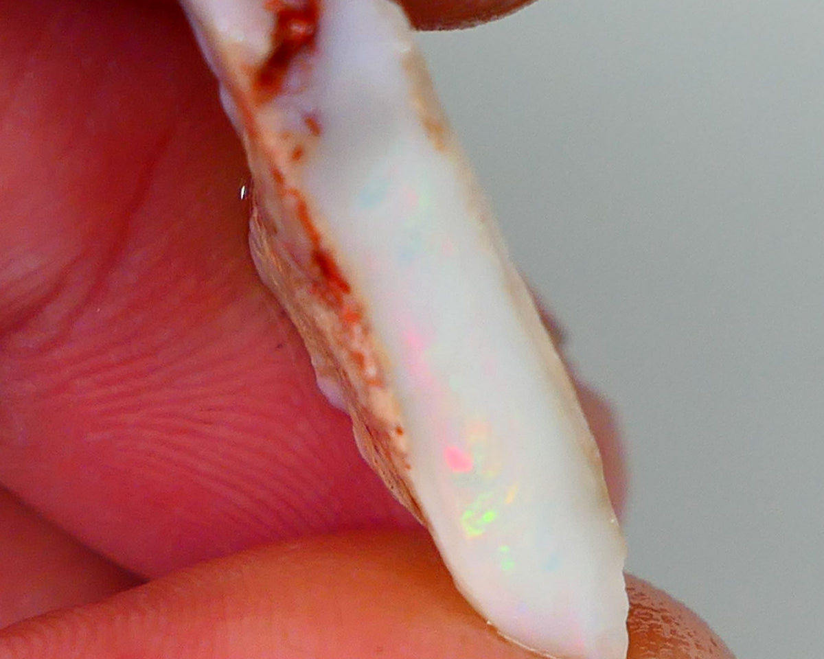 Lightning Ridge Rough Opal 7.25cts Light base Seam showing Bit of Yellow Dominant M.colours 22x10x4mm NS330