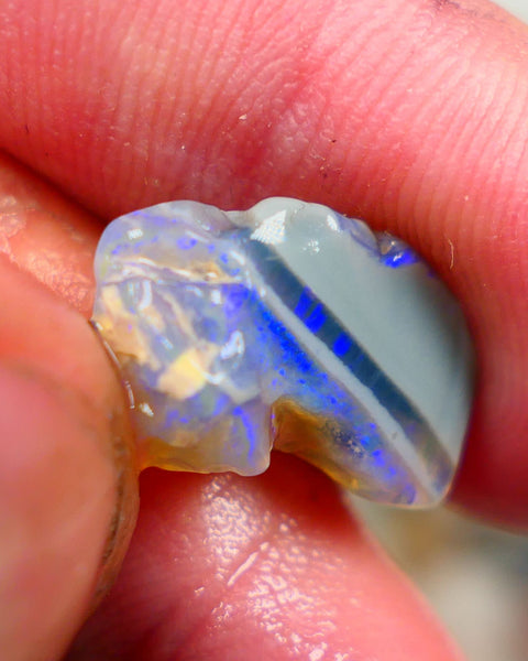 Lightning Ridge Rough Opal 6.00cts Crystal opal carrying fire sat on a bar with blues sat on dark base mother nature hey? Sold as gamble 17x10x7mm Auciton168