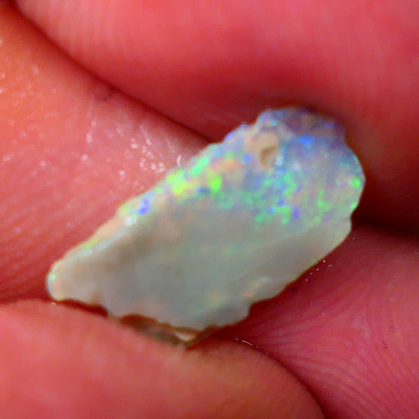 Lightning Ridge Dark base Seam opal 1.95cts Note this is thin So suit inlay/doublet etc Nice Yellow/Blue/Green fires to work with 15x7x3mm GMB-021