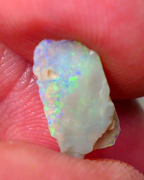 Lightning Ridge Dark base Seam opal 1.95cts Note this is thin So suit inlay/doublet etc Nice Yellow/Blue/Green fires to work with 15x7x3mm GMB-021