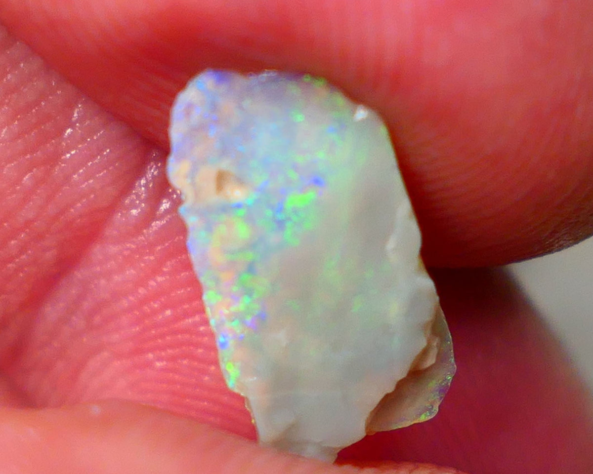 Lightning Ridge Dark base Seam opal 1.95cts Note this is thin So suit inlay/doublet etc Nice Yellow/Blue/Green fires to work with 15x7x3mm GMB-021