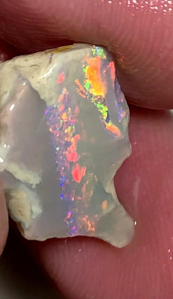Lightning Ridge Rough Opal 7.4cts Crystal on Dark base seam Gorgeous Pinks Oranges Reds & Multifires showing 18x14x5mm WAA53