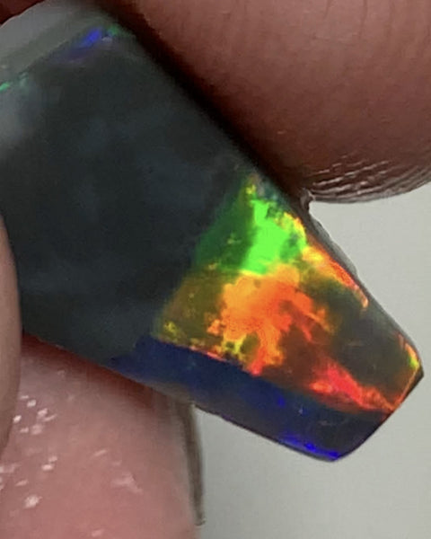 Australian Opal Gem Grade Single semi Black 3.4cts Rub/Rough Super bright Reds & Rainbow of Multifires Broad flash / Flagstone pattern 16x8x3mm WSJ40