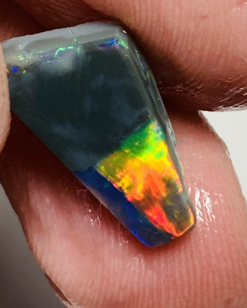 Australian Opal Gem Grade Single semi Black 3.4cts Rub/Rough Super bright Reds & Rainbow of Multifires Broad flash / Flagstone pattern 16x8x3mm WSJ40
